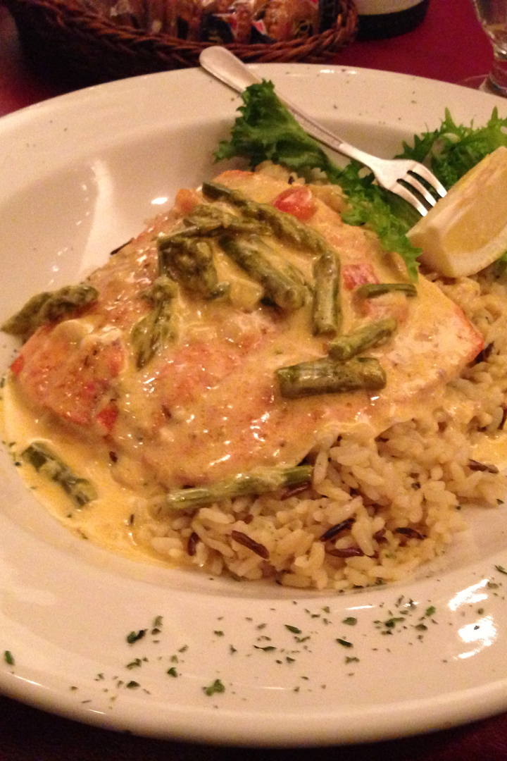 Seafood dinner with green beans, lemons and garnishes