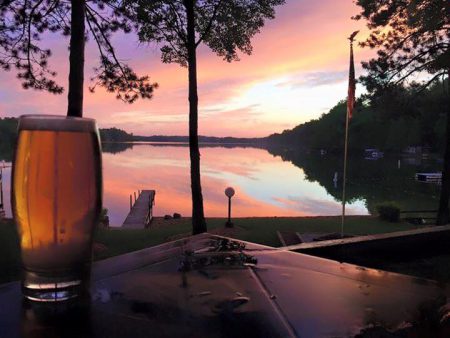 Beautiful sunset with beer in foreground